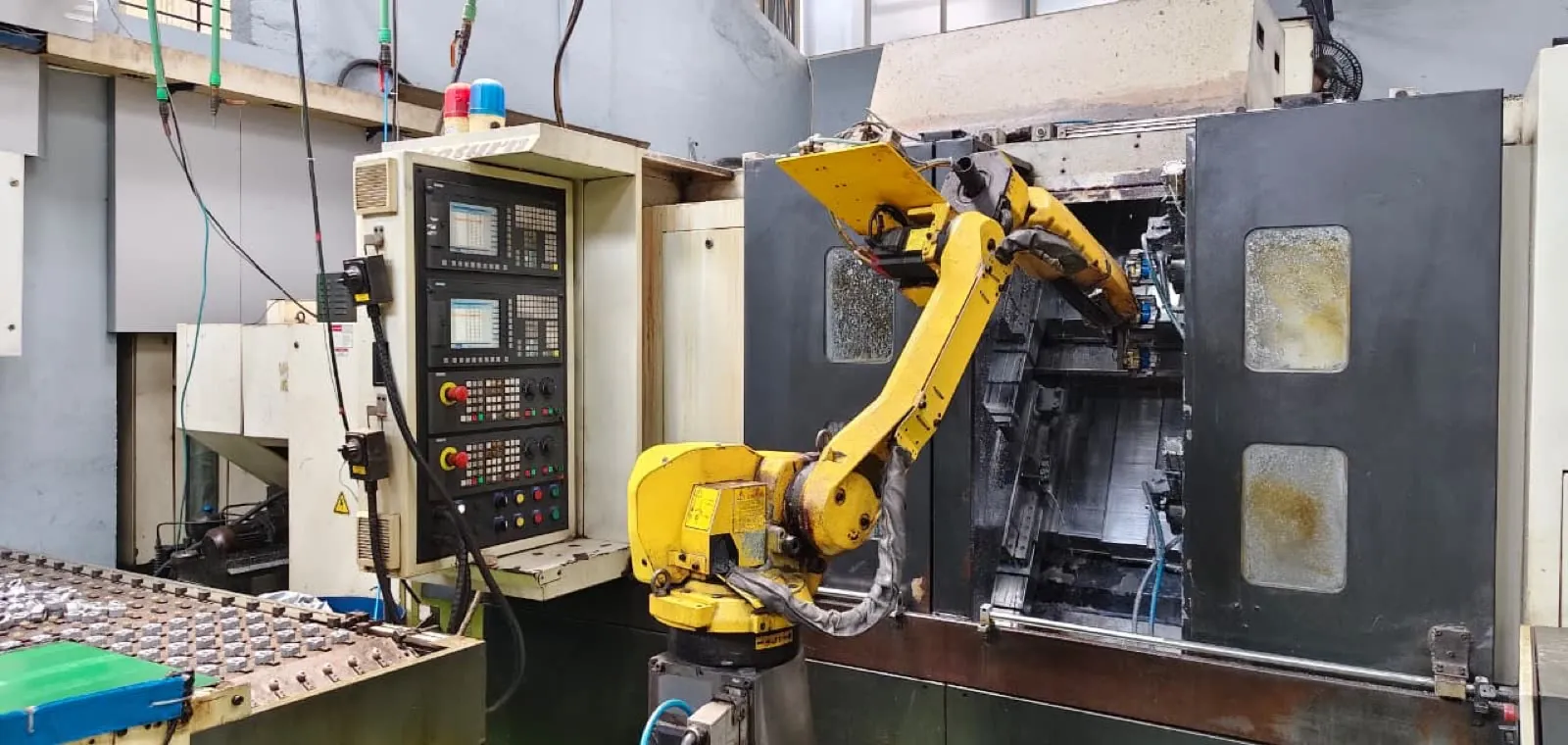Robot arm tending a CNC turning centre at DPS