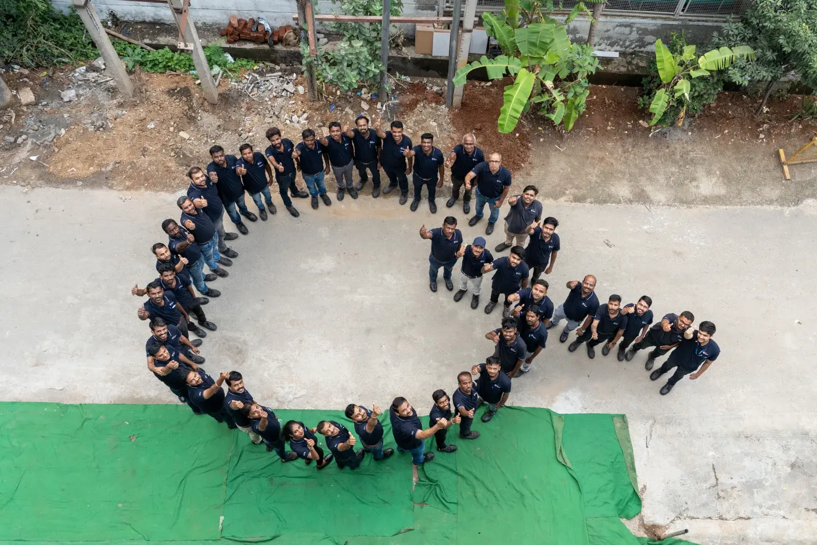 DPS team standing in a circle, aerial view