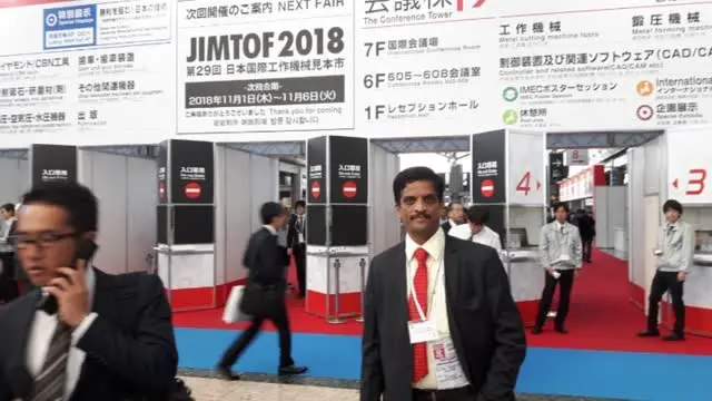 DPS represented by Dr. Sudheendra and R.P. Holla at JIMTOF, Tokyo, Japan — including a visit to the Makino factory.